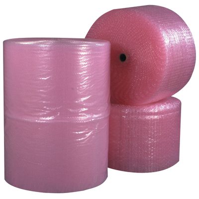 BW31648ASP.jpg Three large MH-USA 3/16 x 48 x 750 Perforated Anti-Static Air Bubble Rolls, two stacked and one upright, feature a shiny, textured surface providing optimal protection for delicate items.