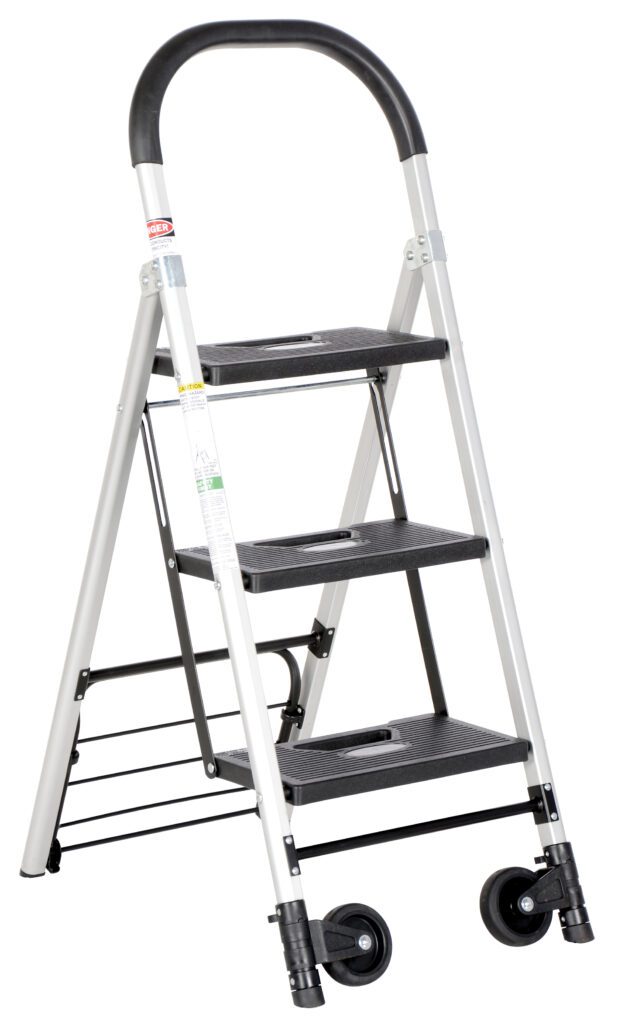 Meet the Vestil Aluminum Ladder Cart 3 Steps 250 Lb, boasting a sleek silver frame and three sturdy black steps. Its curved handle ensures easy grip, while two wheels offer smooth portability. It supports up to 250 lbs, blending modern design with functionality.