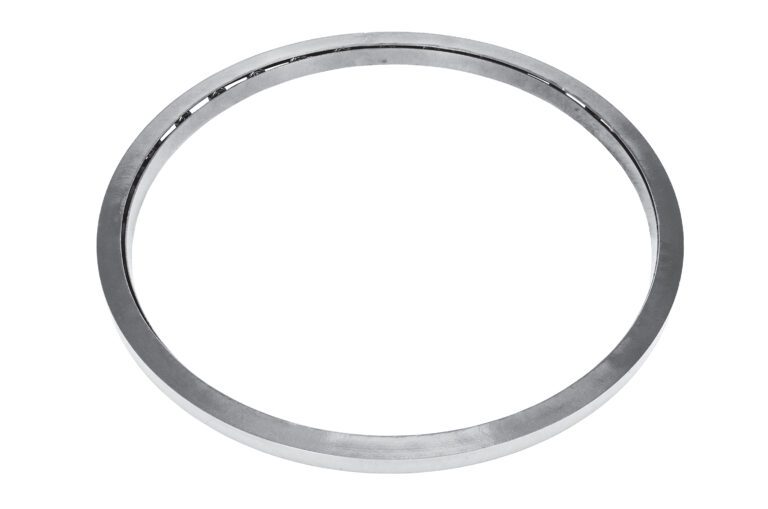 A gleaming silver metal ring, echoing the polished finish of a Vestil Manual Carousel Stainless Steel 6K 40 In, glistens against a plain white background.