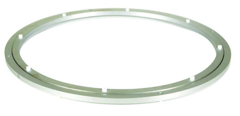 CA-5-24_A.jpg A sleek, thin ring with a smooth silver surface and small protrusions, similar to the Vestil Mini Aluminum Carousel, is elegantly shown against a pristine white background.