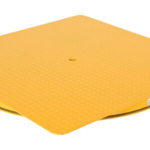 A large, yellow plastic lid with a textured surface and central hole rests on the ground, similar to a Vestil Hd King Pin Carousel. Its square top curves downwards with partially visible sides and a small label on one side.