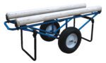 The Vestil Rug Dispenser features a blue metal trolley with a single axle and two large black pneumatic wheels, ideal for transporting long cylindrical objects. It securely holds two white PVC pipes and measures 25.94 x 61, with a handle on one side for easy maneuvering.