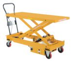 The Vestil Dc Power Hydr Scissor Cart 1K 60 X 24.5 features a yellow hydraulic lift table on wheels with a scissor mechanism, flat platform, manual handle, and red and black swivel casters for easy operation and optimal mobility.