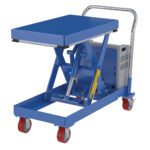 The Vestil Hydraulic Elevating Cart 20X33, with a 500 lb capacity, features a blue scissor lift table, silver handle, and red caster wheels. Its shown partially lifted and powered by a 12V DC system for efficiency and mobility.