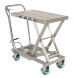 The Vestil Cart Scissor 500Lb Capacity Stainless Steel features a hydraulic lift table with a handle and four green wheels. It includes safety warning labels, making it ideal for lifting and transporting heavy items.