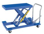 The Vestil Cart Scissor Low Profile Foot Pump 20X40 2000# offers a blue hydraulic table with a rectangular platform, four caster wheels, a metal steering handle, an operational lever, a foot pump, and a yellow safety latch. It supports up to 2000 pounds.