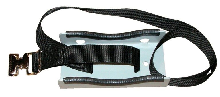 The Vestil Steel Wall-Mounted 1 Cylinder Bracket has a black strap with a metal clip attached to a white base featuring curved edges and two slots for adjustable looping, with the clip on the left side for secure fastening.