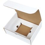 The MH-USA 11 1/8 x 8 3/4 x 4 White CD Literature Mailer Kit (50/Bundle) is an open white cardboard box with a hinged lid and square cutout at the bottom. The interiors simple brown design hints at its purpose: securely holding and displaying specific items.