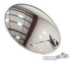 The Vestil Convex Mirror Indoor 20 Ft Distance is designed for indoor use, reflecting a warehouse ceiling, lights, and a pole from distances up to 20 ft. It attaches securely with screws to a durable metal bracket against a plain white background.