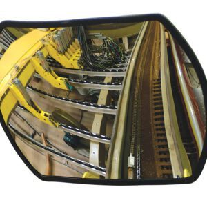 The Vestil Convex Mirror Rectangular 26 Ft Distance captures an industrial setting featuring machinery with yellow components, wires, and metal tracks, reflecting the manufacturing environments mechanical focus.