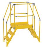 The Vestil Cross-Over Ladder 3 Step offers a yellow industrial metal platform with stairs on both sides and railings. It features non-slip tread surfaces, stands 28 inches high, and is 26 inches wide, providing freestanding access or enhanced safety in work settings.