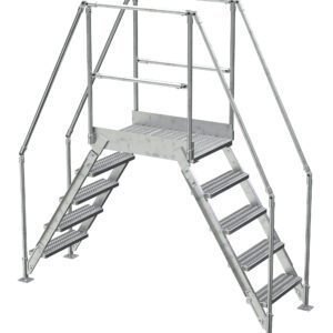 The Vestil Aluminum Cross Over Ladder 26 Wide 5 Step is a freestanding structure featuring a metal platform connected by railings, with two sets of stairs. Each stairway has five textured steps for grip, elevating the platform safely above ground level.
