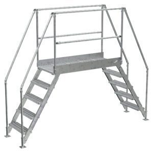 The Vestil Aluminum Cross Over Ladder 50 Wide 5 Step features handrails and provides a secure, durable path over obstacles in industrial settings, with five steps on each side leading to a central platform.