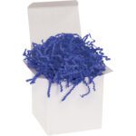 An open white gift box filled with MH-USA 10 lb. Royal Blue Crinkle Paper (10 Lbs/Case) sits against a plain background, with the vibrant blue paper spilling over the edges for a decorative touch.
