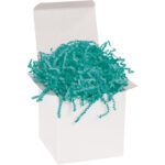 An open white gift box brimming with MH-USA 10 lb. Teal Crinkle Paper creates a textured, wavy display that captivates with its vibrant teal allure, making it the perfect decorative touch amidst a plain box.