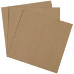 Three brown, textured pieces similar to MH-USA 12 x 12 Chipboard Pads (625 Pads/Case) are stacked and fanned out against a white background, highlighting their simplicity and versatility for creative projects.