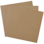 Three brown square sheets of medium-density fiberboard are slightly askew on a white background, showing a smooth texture ideal for crafting and construction, similar to the MH-USA 14 x 14 Chipboard Pads (460 Pads/Case) available in bulk.