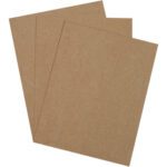 Three sheets of brown sandpaper overlap against a white background, reminiscent of the durable MH-USA 8 1/2 x 11 Extra Heavy Duty Chipboard Pads, available in a sturdy case of 470 pads.