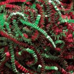 Interwoven zigzag-shaped paper strips in red, green, and brown from MH-USA 10 lb. Christmas Blend Crinkle Paper evoke a festive theme with their textured and crumpled appearance.