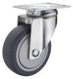 The Vestil 5X1-1/4 Tpr, Swivel caster wheel features a gray rubber tire and robust metal frame for easy movement. Its securely installed via a sturdy mounting plate with four holes.