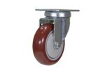 The Vestil 4X1 Polyurethane Swivel Caster is a red wheel with a white center and metal mounting bracket. It features a metallic swivel mechanism for easy attachment, making it ideal for improving the mobility of furniture or equipment.
