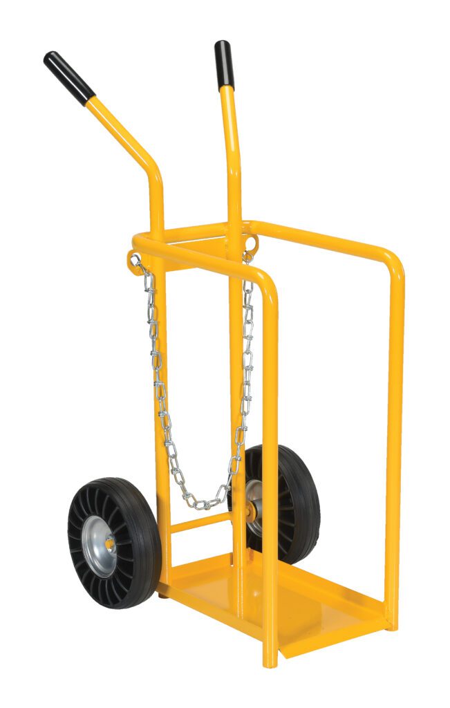 The Vestil Cylinder Tilt Back Hand Truck 150 Lb moves heavy items with a yellow frame, two black wheels, a metal base, and two handles with black grips. A front chain secures loads up to 150 lbs efficiently.