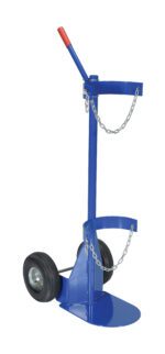 Introducing the Vestil Cylinder Dolly With Pneumatic Wheels: a blue dolly featuring two robust black pneumatic wheels, a vibrant red handle, and metal chains for secure transport. It includes circular holders tailored for safely carrying gas cylinders.