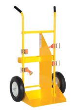 The Vestil Cylinder Torch Cart-Pneumatic Wheel 57In is a robust yellow hand truck equipped with two black pneumatic wheels, strong orange straps, black handles, and a raised flat platform for easy and stable item transport.