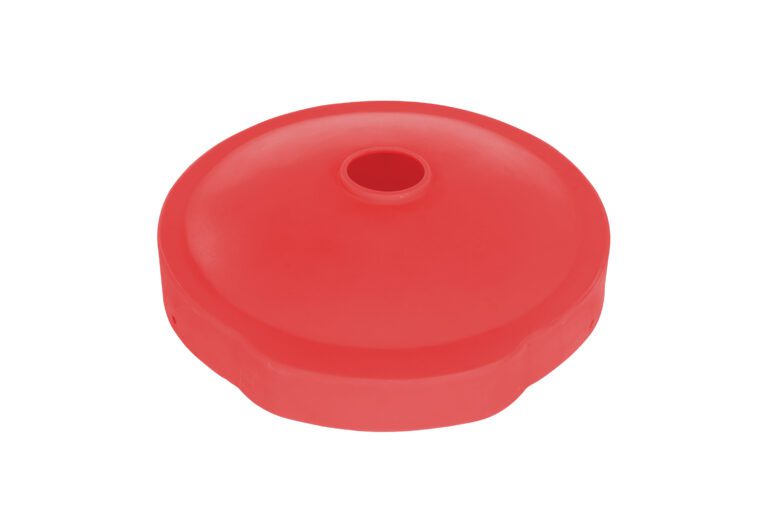 A red, circular plastic object with a central hole resembles the Vestil Drum Recyc Flap 55Gal(Closed/Open) Red, displayed on a white background.