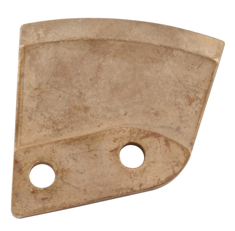 DDB-1-NS_A.jpg A triangular, weathered metal piece with two round holes by one edge, similar to a bracket. Its rusty surface suggests it might once have been part of a Vestil Non Spark Drum Deheader Replac. Blade.