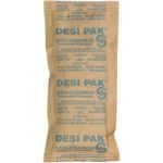 The SÜD-CHEMIE DESI PAK is a brown 3 x 6 x 3/8 Kraft Clay desiccant packet with blue-printed instructions and contact info, highlighting DO NOT EAT and Performance Packaging, perfect for use in a 34 Gallon Drum (800/Drum).