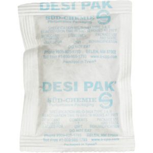 The compact, white DESI PAK labeled 3 x 4 x 1/4 Tyvek® Clay Desiccant features blue text and vital instructions like Do Not Eat. Designed for moisture absorption, each desiccant is sold in a 34-gallon drum containing 1300 units by SÜD-CHEMIE Performance Packaging.