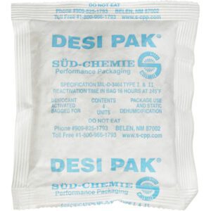 The 5 x 5 1/2 x 1/2 Tyvek® Clay Desiccants come in a 34 Gal Drum, with each white silica gel packet labeled DESI PAK, featuring blue text detailing manufacturer info and usage instructions, plus a cautionary DO NOT EAT message.