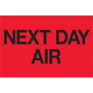 A vibrant red rectangle with bold black text saying NEXT DAY AIR, similar to MH-USA 2 x 3 Fluorescent Red Labels, ideal for urgent shipments.