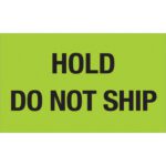 A vivid fluorescent green sign, like the MH-USA 3 x 5 Hold - Do Not Ship (Fluorescent Green) labels, clearly displays in black text: HOLD DO NOT SHIP.
