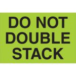 A fluorescent green sign with bold black text DO NOT DOUBLE STACK catches attention, similar to MH-USA 2 x 3 Do Not Double Stack labels, which come in rolls of 500 for efficient use.