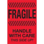The MH-USA 4 x 6 labels are vibrant fluorescent red with bold black text reading FRAGILE on top, HANDLE WITH CARE beneath, and THIS SIDE UP! at the bottom. Diagonal lines highlight “FRAGILE.” These labels come in rolls of 500.