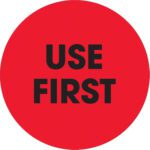 A vibrant red circle, featuring the bold black phrase USE FIRST, similar to MH-USA 2 Circle - Use First Fluorescent Red Labels (500/Roll), grabs immediate attention.
