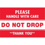 A red and white sign with PLEASE HANDLE WITH CARE DO NOT DROP THANK YOU resembles the MH-USA Do Not Drop 2 x 3 Labels (500/Roll).