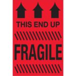 The MH-USA 2 x 3 This End Up - Fragile (Fluorescent Red) labels feature three black upward arrows with THIS END UP, diagonal stripes, and FRAGILE for emphasis. Sold in rolls of 500, theyre perfect for versatile usage.