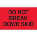 A fluorescent red sign with bold black text saying, DO NOT BREAK DOWN SKID, resembles the MH-USA 3 x 5 labels in rolls of 500.