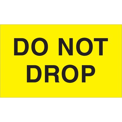 DL2341.jpg A yellow sign with bold black text reading DO NOT DROP resembles the MH-USA 3 x 5 - Do Not Drop fluorescent yellow labels (500/roll), ensuring high visibility and serving as a critical reminder.