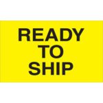 A vibrant yellow sign with bold black text saying READY TO SHIP matches the MH-USA 3 x 5 - Ready to Ship (Fluorescent Yellow) Labels, which come in rolls of 500.