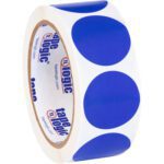 A roll of white adhesive tape with large blue dots, paired with MH-USA 1 1/2 Dark Blue Inventory Circle Labels (500/Roll), showcases Tape Logic branding on the inner cardboard ring.