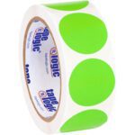 A roll of white adhesive tape has large fluorescent green circles similar to MH-USA 1 1/2 Fluorescent Green Inventory Circle Labels (500/Roll), with Tape Logic boldly printed in blue and red on the inside.