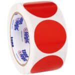 A roll of tape features large red dots on a white background, with tape logic branding inside. It mirrors the MH-USA 2 Red Inventory Circle Labels (500/Roll), combining functionality with vibrant style.