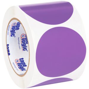 A roll of MH-USA 3 Purple Inventory Circle Labels (500/Roll) displays large purple circles. This Tape Logic item is partially unwound, showing several vibrant labels.