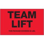 The MH-USA 3 x 5 Team Lift fluorescent red labels showcase TEAM LIFT in black with a caution: THIS PACKAGE EXCEEDS 50 LBS. Each roll contains 500 crucial safety labels.