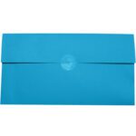A rectangular bright blue envelope, with a flap folded over the back, is sealed using an MH-USA 2 Clear Circle Mailing Label from the 1,000/roll pack, standing out against a plain white background.