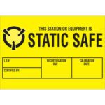 A yellow sign with black encircling arrows and a pointed shape symbol indicates static safety. It reads: This station or equipment is static safe. Sections for I.D. #, Certified By, Recertification Due, and Calibration Date are blank. Fits MH-USA 1 3/4 x 2 1/2 - Static Safe Labels (500/Roll).